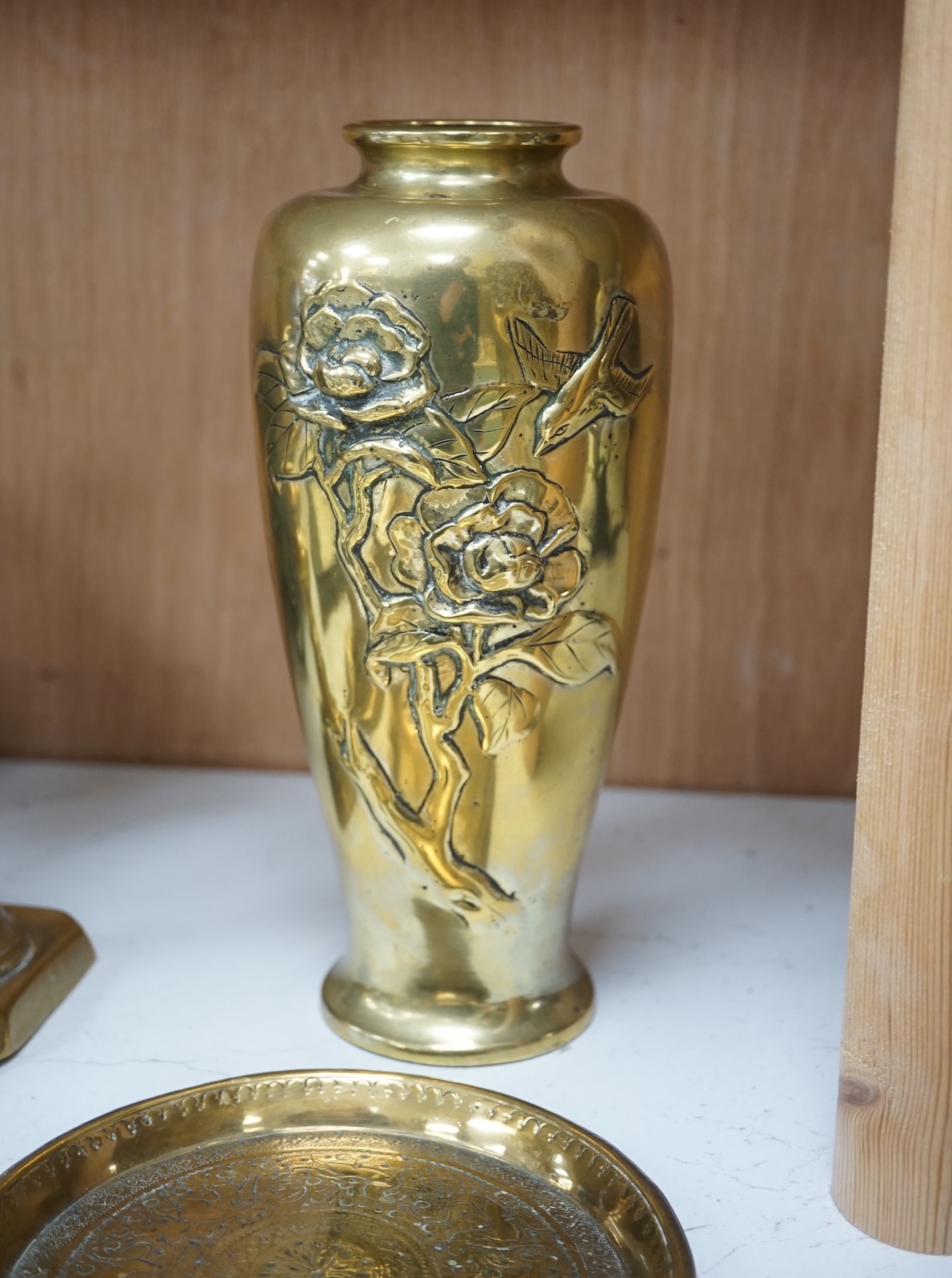 A Dutch repousse coal bin and cover, two pairs of candlesticks, a vase and two dishes, coal bin 43cm high. Condition - cover to bin wrapped slightly